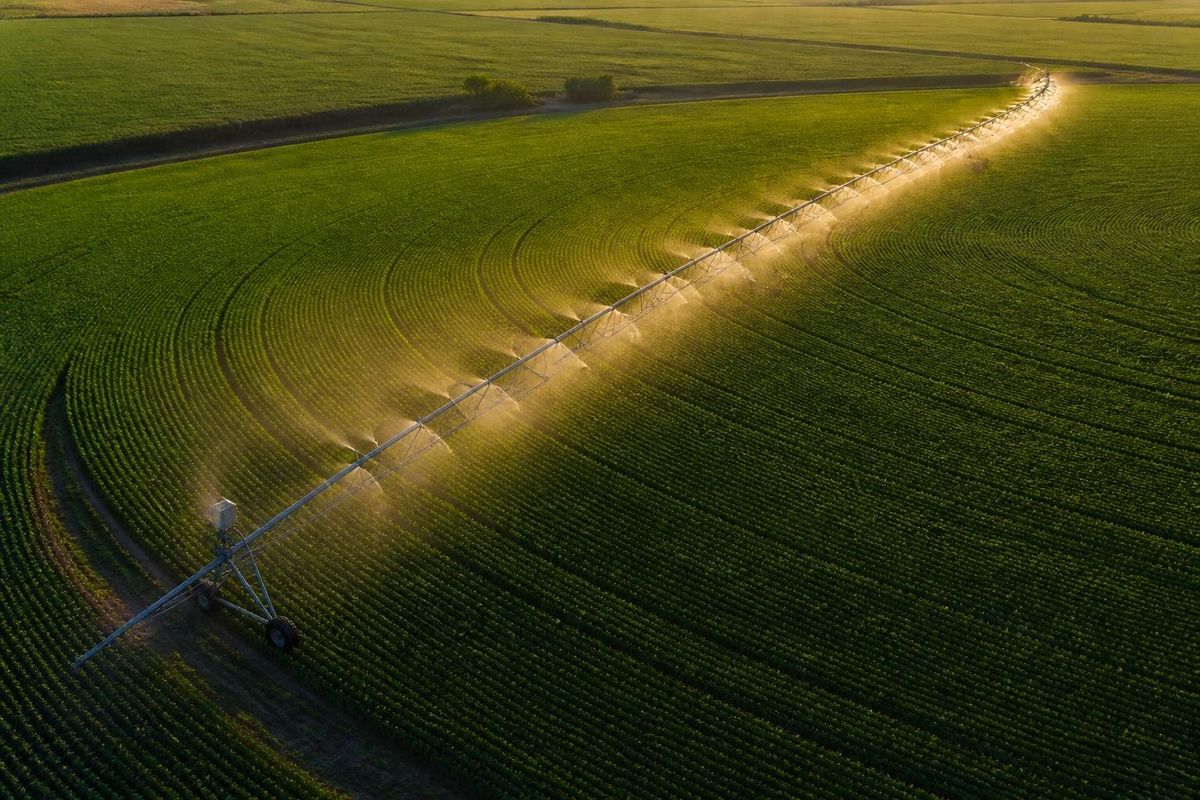 Center-Pivot Irrigation — Irrigation Infrastructure in Sub-Saharan Africa Aerial view of large-scale center-pivot irrigation circle serving open-field row crops in Sub-Saharan Africa